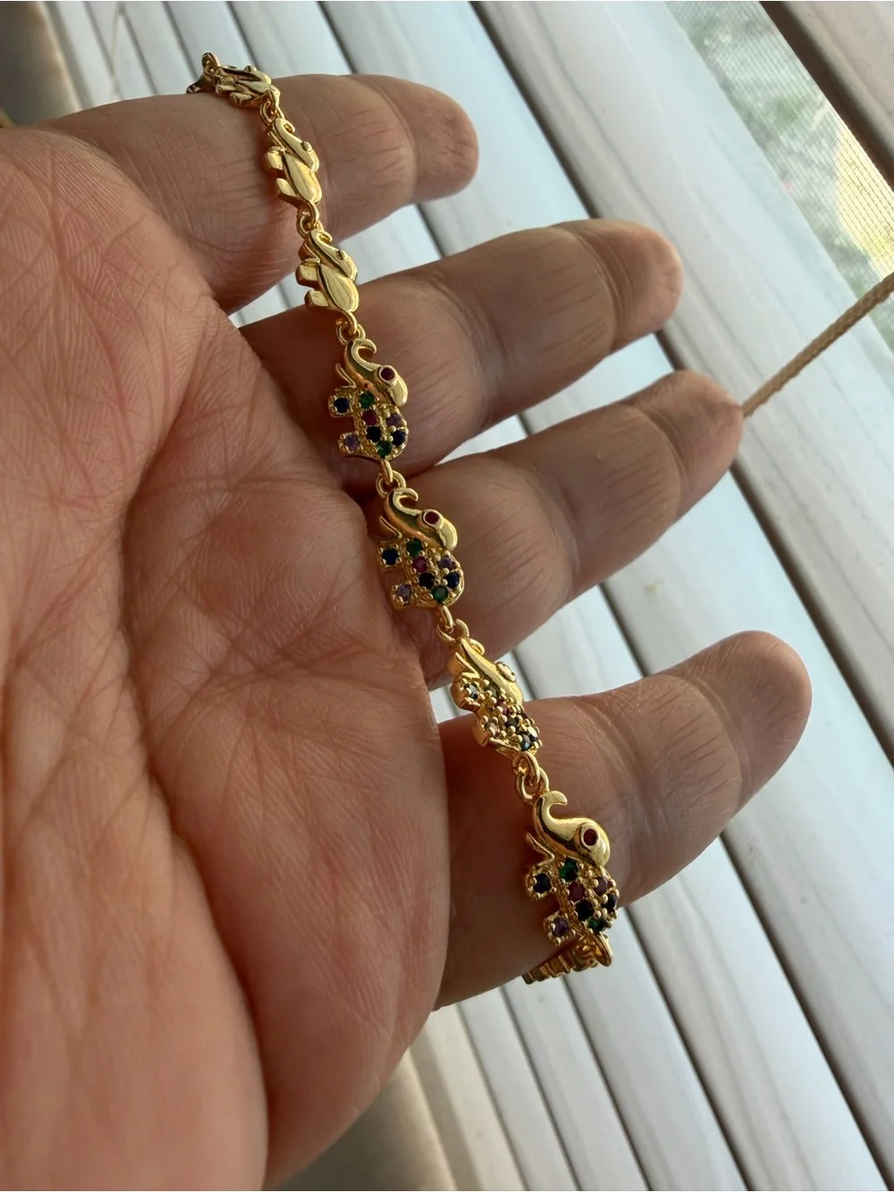 Gold Tone Elephant bracelet with multi color accents